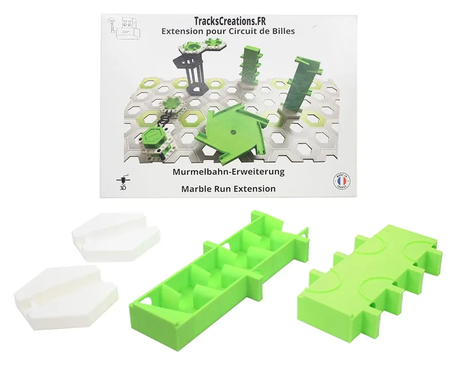 Pack zigzag et demi-tour vertical devant sa boîte TracksCreations : deux pièces vertes et deux supports blancs
