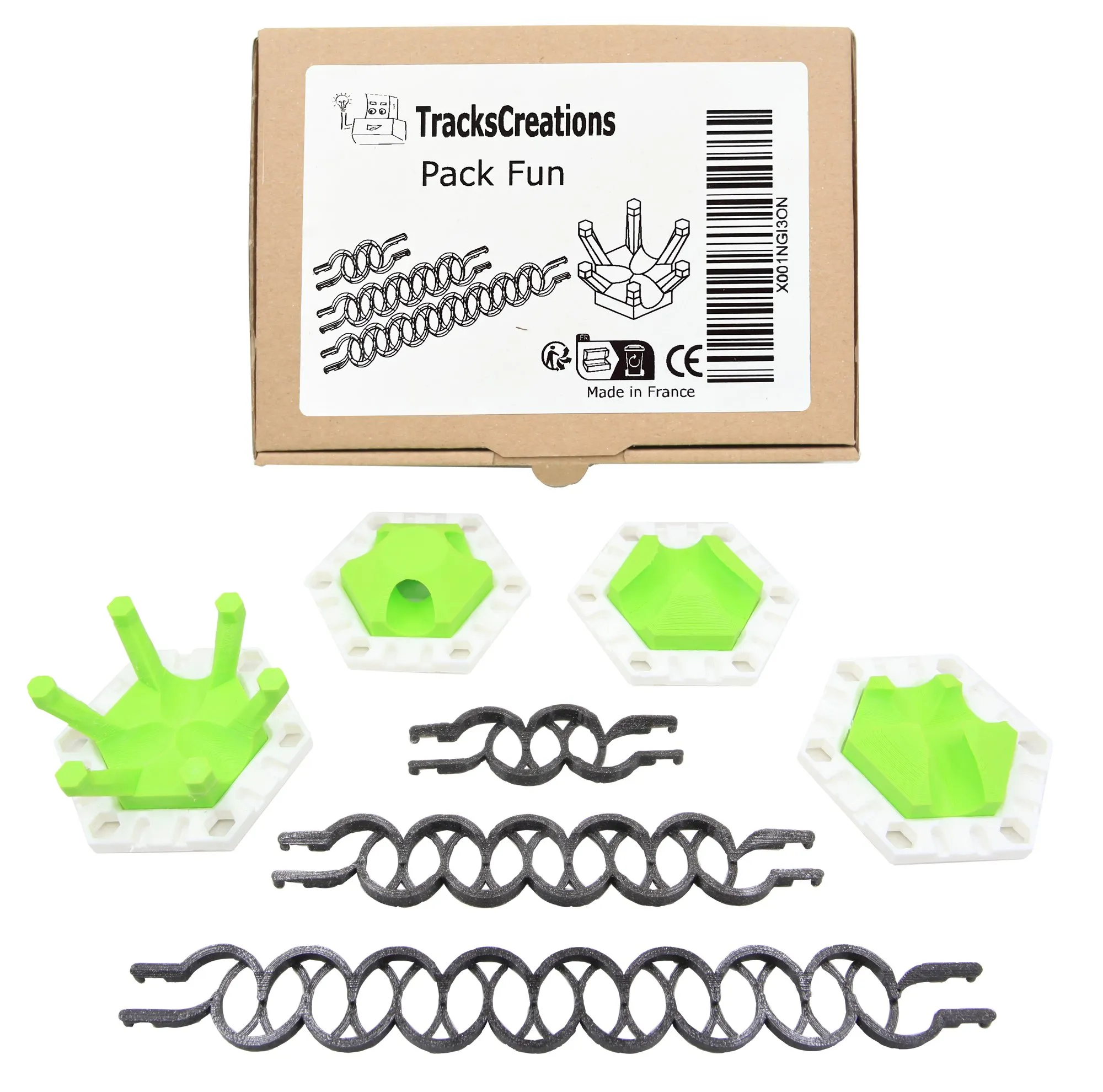 Contenu du pack Fun : quatre plaques blanches à pièces vertes et trois rails zigzag noirs, devant la boîte TracksCreations